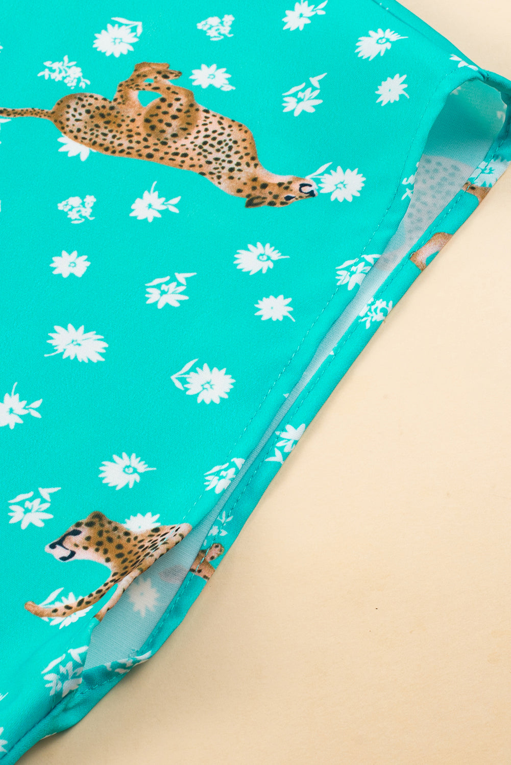 Green cheetah print short sleeve plus top: front